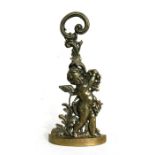 A polished bronze door stop in the form of a cherub, 49cms (19.25ins) high.Condition Report Good