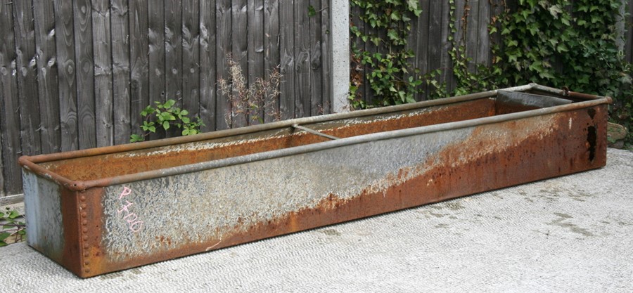 A large galvanised water trough or planter, 244cms (96ins) long.