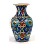 A Persian Iznik pottery vase decorated with flowers, 22cms (8.75ins) high (a/f).Condition Report