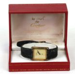 A 1980's Must de Cartier tank silver gilt wrist watch, numbered '095187', in original box.