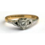 An 18ct gold diamond ring in a heart shaped setting, approx UK size 'N'.
