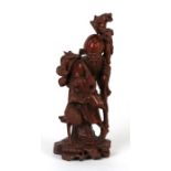 A Chinese hardwood figure in the form of Shoulau, 25cms (9.75ins) high.