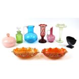 A Vaseline glass vase, 18cms (7ins) high; together with a ruby flashed glass vase, 19cms (7.5ins)