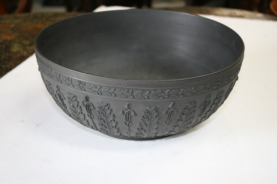 A Wedgwood black basalt bowl decorated with flowers and foliage, 28cms (11ins) diameter (restored). - Image 5 of 6