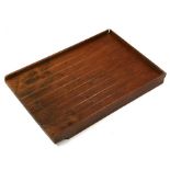 A teak kitchen drainer, 54.5 by 78cms (21.5 by 30.7ins).