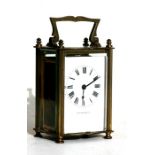 A Mappin & Webb brass cased carriage time piece, 11cms (4.25ins) high.