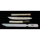 A group of four late 19th / early 20th century ivory letter knives, one with a silver mounted