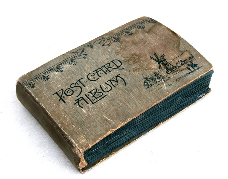 An early 20th century postcard album including military and Mabel Lucy Attwell postcards.