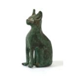 An Egyptian bronze figure in the form of a seated cat, 9cms (3.5ins) high.