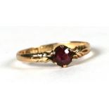 A 15ct gold and garnet ring, approx UK size 'O'.