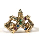 A 9ct gold gem set ring in the form of a clown, approx UK size 'P'.