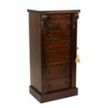 A Victorian style mahogany Wellington chest with seven short drawers, on a plinth base,51cms (20ins)