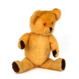 A plush jointed teddy bear, 41cms (16ins) high.