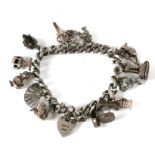 A silver charm bracelet and charms, total weight 62g.
