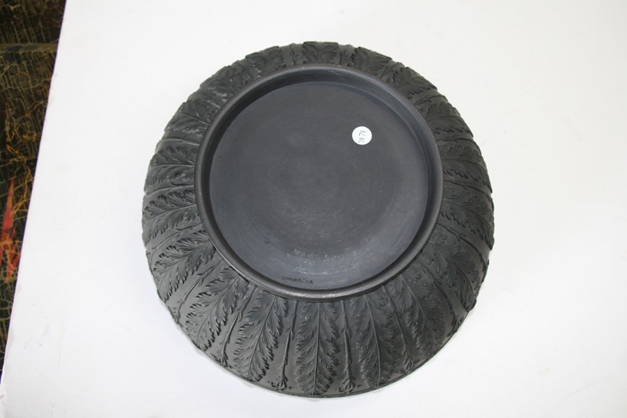 A Wedgwood black basalt bowl decorated with flowers and foliage, 28cms (11ins) diameter (restored). - Image 2 of 6