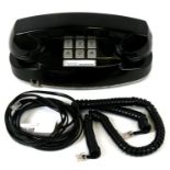 A vintage Princess black push button telephone.