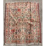 A Persian Meshed woollen hand knotted rug with floral design on a beige ground, 180 by 130cms (71 by
