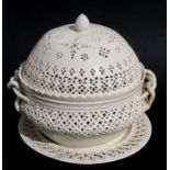 A Leeds Pottery cream ware chestnut basket, cover and stand, each piece with pierced decoration,