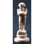 A 19th century ivory carving in the form of Napoleon, 7.5cms (3ins) high.