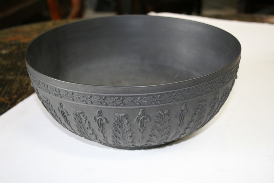 A Wedgwood black basalt bowl decorated with flowers and foliage, 28cms (11ins) diameter (restored). - Image 6 of 6