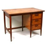 A 20th century satinwood and teak desk with three short drawers, 107cms (42ins) wide.