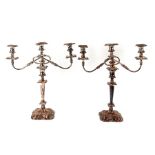 A pair of three-arm silver plated candelabra, 46cms (18ins) high.