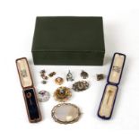 A Victorian agate brooch; together with a Victorian silver horseshoe brooch; a 9ct gold front and