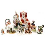 A quantity of 19th century Staffordshire Pottery groups including figures and animals (10).