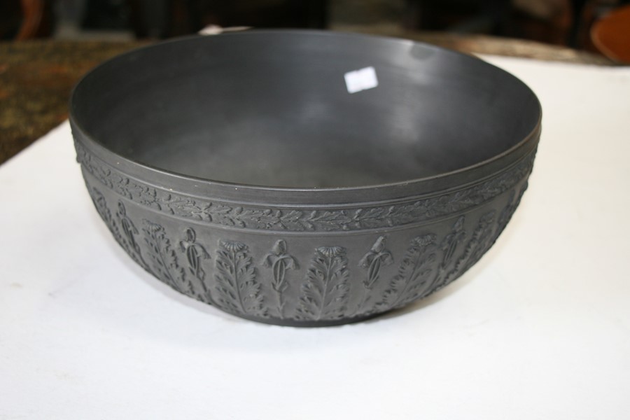A Wedgwood black basalt bowl decorated with flowers and foliage, 28cms (11ins) diameter (restored). - Image 4 of 6