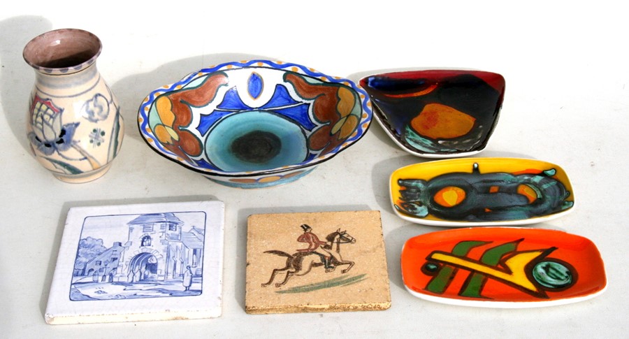 Three Poole Pottery dishes; together with a Collard Honiton pottery bowl and vase; and two tiles.