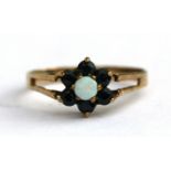 A 9ct gold opal and sapphire cluster ring, approx UK size 'L'.