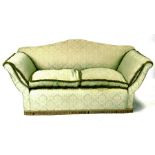 A green upholstered two-seater sofa, 179cms (70ins) wide.