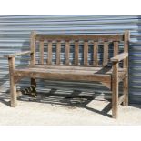 A teak garden bench, 127cms (50ins) wide.