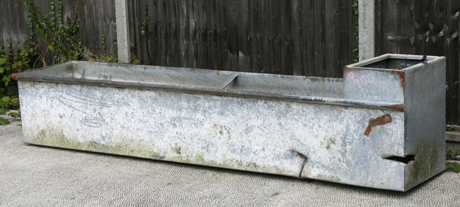 A large galvanised water trough or planter, 244cms (96ins) long.