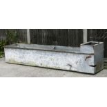 A large galvanised water trough or planter, 244cms (96ins) long.