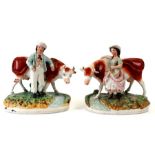 A pair of 19th century Staffordshire Pottery groups depicting figures with cows, 22cms (8.5ins)