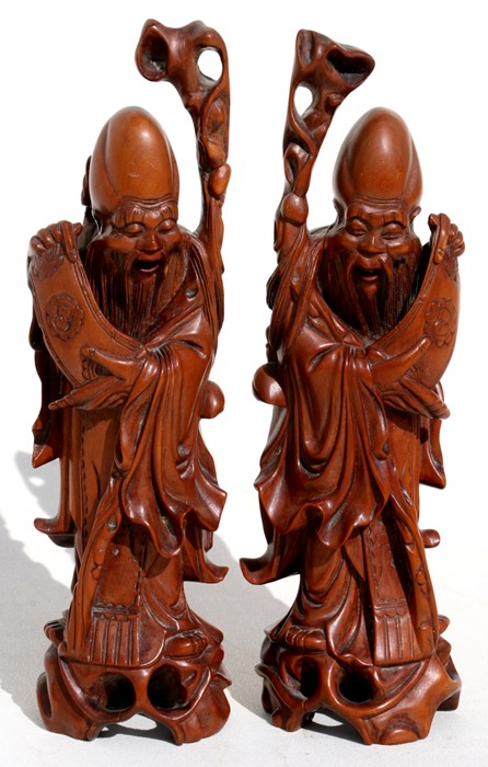 A pair of Chinese hardwood figures depicting Shoulau, 19cms (7.5ins) high.