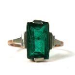 A 9ct gold dress ring set with a rectangular green stone, approx UK size 'O'.