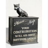 A 1920's charity collection box painted with 'Please Help, Your Contribution will Aid Some Suffering