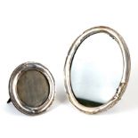 An oval silver strut photograph frame; together with a circular silver strut photograph frame (2).