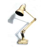 A Herbert Terry anglepoise lamp on square stepped base.