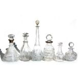 Two silver mounted cut glass decanters; together with a group of other cut glass decanters.