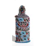 An unusual antique beadwork bottle dated 1901 and decorated with birds and flowers, 22cms (8.5ins)