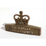 A cast iron 'The Nature Conservancy' sign surmounted with a crown, 45cms (17.75ins) wide.