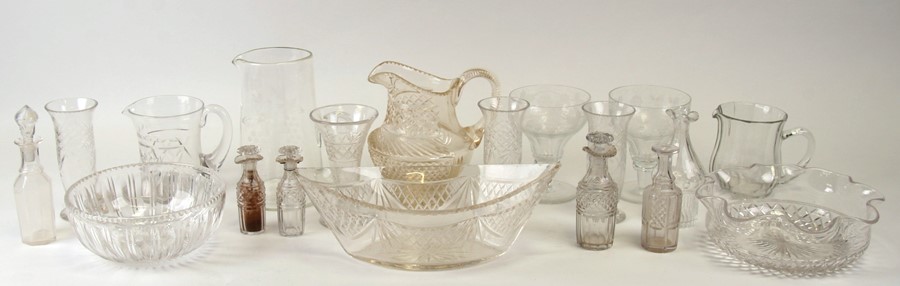 A quantity of cut glass vases and jugs.