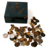 A quantity of coins, medals, medallions, tokens and badges contained in a wooden box with applied