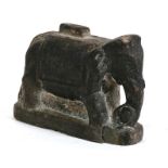 An antique Indian carved stone elephant base, 10cms (4ins) high.