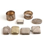 A silver vesta case, Chester 1916; together with three other vesta cases; two silver napkin rings; a