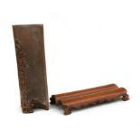 A Chinese bamboo arm rest depicting Shoulau with a young boy; together with another bamboo arm