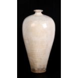 A Chinese white glazed Meiping vase, 29cms (11.5ins) high.Condition Report Crazing to the glaze